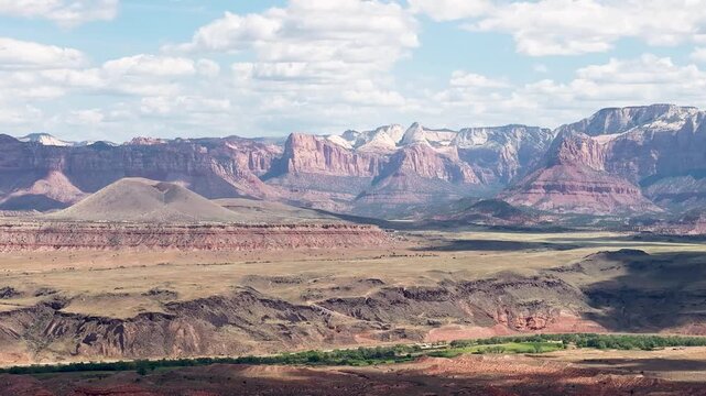 Enjoy aerial hyperlapse views of Zion National Park, capturing the dramatic landscapes from Gooseberry Mesa and clear blue skies.