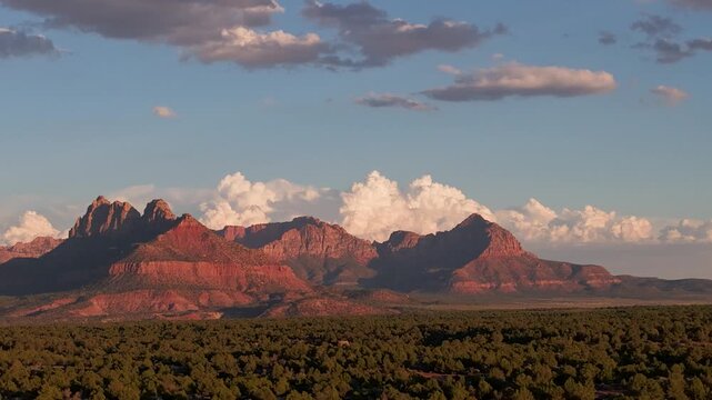 Aerial time lapse offers sweeping views of Zion National Park seen from Gooseberry Mesa in Utah under a clear blue sky.