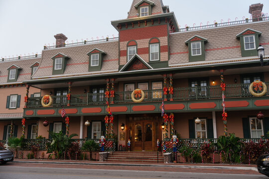 St. Augustine,FL,USA - Dec.30.2024: A historic hotel in downtown St. Augustine, Florida, displays glowing wreaths, bows, ornaments, and candy canes. The grand Victorian building features a long