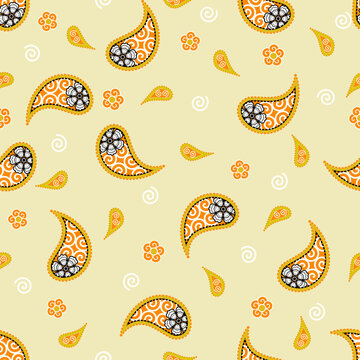 A vibrant vintage paisley seamless pattern featuring mustard yellow and orange floral motifs with fine details on a soft yellow background for fabric designs.