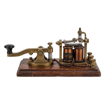 Telegraph key crafted from vintage brass and wood rests on a surface to represent early communication.