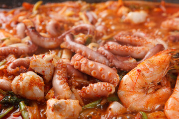 Close up of Korean spicy seafood hot pot with octopus tentacles and shrimp © Donghyun Kim