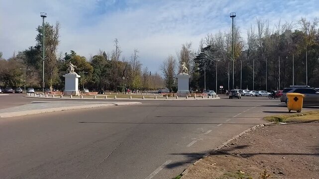 Marly's Horses equestrian statues at General San Martin Park in Mendoza, Argentina. Urban public space with pedestrians and trees.