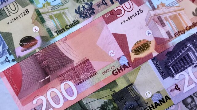 Ghana, Ghanaian paper money, cedi banknotes and pesewa coins as currency for exchange or travel. Ghana money as a business background