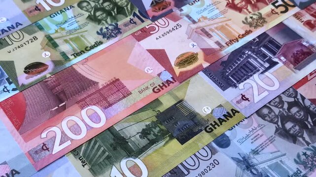 Ghana, Ghanaian paper money, cedi banknotes and pesewa coins as currency for exchange or travel. Ghana money as a business background