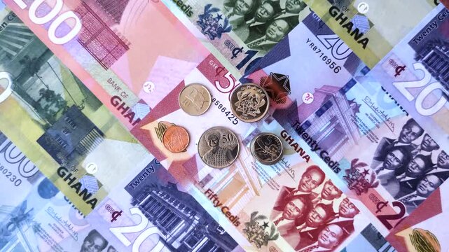 Ghana, Ghanaian paper money, cedi banknotes and pesewa coins as currency for exchange or travel. Ghana money as a business background
