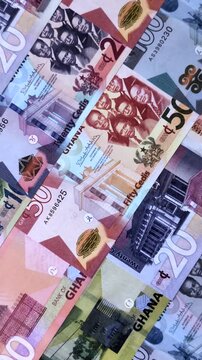 Ghana, Ghanaian paper money, cedi banknotes and pesewa coins as currency for exchange or travel. Ghana money as a business background