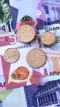 Ghana, Ghanaian paper money, cedi banknotes and pesewa coins as currency for exchange or travel. Ghana money as a business background