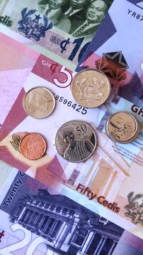 Ghana, Ghanaian paper money, cedi banknotes and pesewa coins as currency for exchange or travel. Ghana money as a business background
