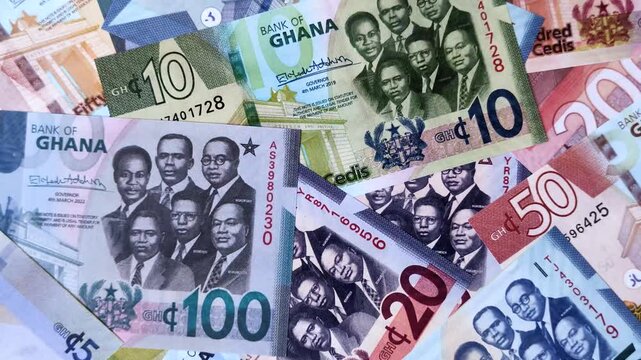 Ghana, Ghanaian paper money, cedi banknotes and pesewa coins as currency for exchange or travel. Ghana money as a business background