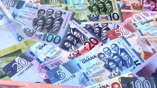 Ghana, Ghanaian paper money, cedi banknotes and pesewa coins as currency for exchange or travel. Ghana money as a business background