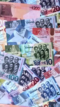 Ghana, Ghanaian paper money, cedi banknotes and pesewa coins as currency for exchange or travel. Ghana money as a business background