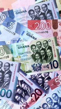 Ghana, Ghanaian paper money, cedi banknotes and pesewa coins as currency for exchange or travel. Ghana money as a business background