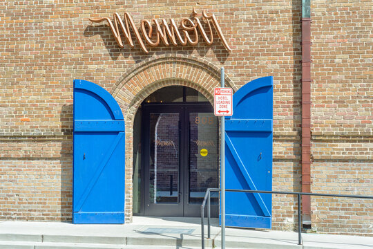 New Orleans, LA, USA - September 15, 2025: Front Entrance to Memoir Apartment Style Hotel Building on Constance Street in the Warehouse District