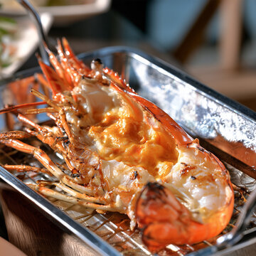 A photorealistic large grilled river prawn split open lengthwise and laid flat, showcasing its juicy succulent meat and rich golden-orange prawn roe inside the head, vibrant orange-red grilled 