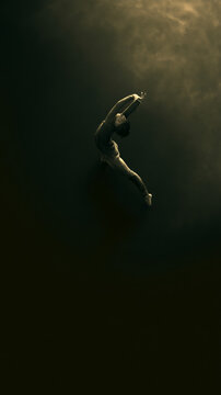 Minimalist lone person stretching from low angle with moody low key lighting