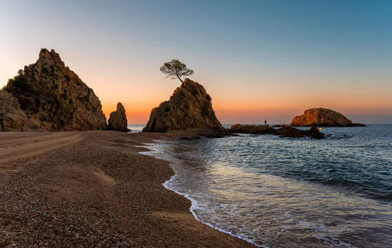 Platja Mar Menuda beach in Tossa de Mar during sunrise on Costa Brava in Spain