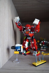 Fototapeta premium Lego Sonic the Hedgehog Knuckles Guardian Mech set displayed on a wooden shelf in a bedroom