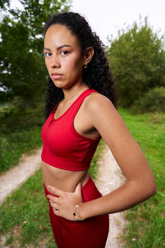 Determined woman runner looking serious in nature