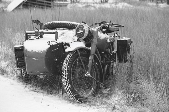 German WWII Military Motorcycle With Sidecar in Winter Field