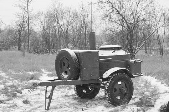 WWII Mobile Field Kitchen Trailer in Winter Landscape
