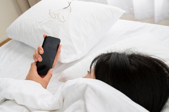 Checking Smartphone Time in Bed