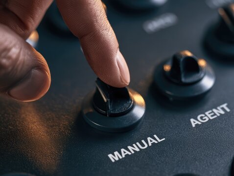 Hand moving a toggle switch from MANUAL to AGENT for AI task delegation