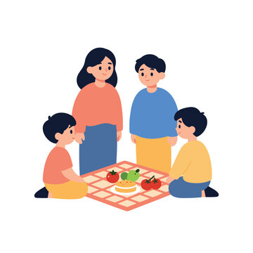 A mother, father, and two children sit together on a picnic blanket with food.