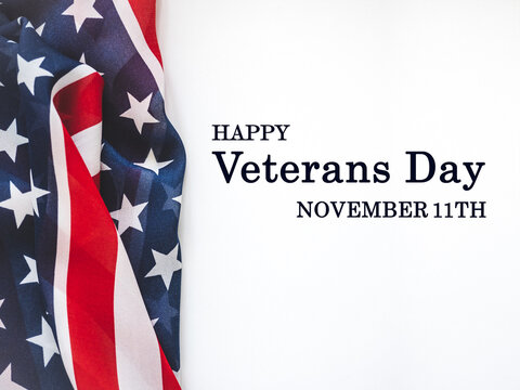 Veterans Day (11th November) greeting card with American Flag (Stars and Stripes) on a white background. Patriotic holiday tribute to military veterans. Ideal for November 11th commemoration content
