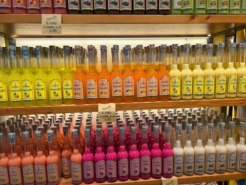 Liquor store. Limoncello in assortment, sweet fruit liqueurs. Palermo, Italy, September 2, 2026.