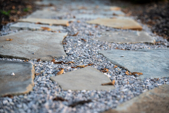 Flagstone and Gravel Garden Pathway with Autumn Leaves. Landscaping Background Banner