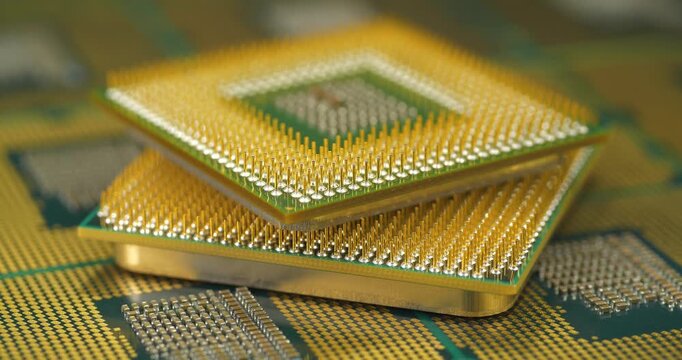 Modern central processors with gold plated pins and contacts representing advanced computer hardware high performance technology and powerful personal computing systems