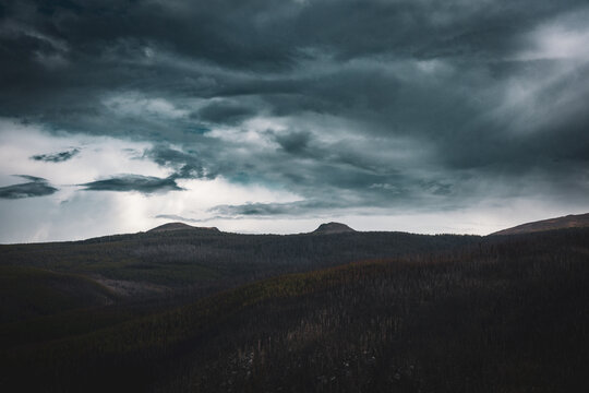 Dark storm clouds above layered Cathedral Park ridges