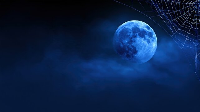 Full moon and spiderweb in midnight blue sky Halloween banner