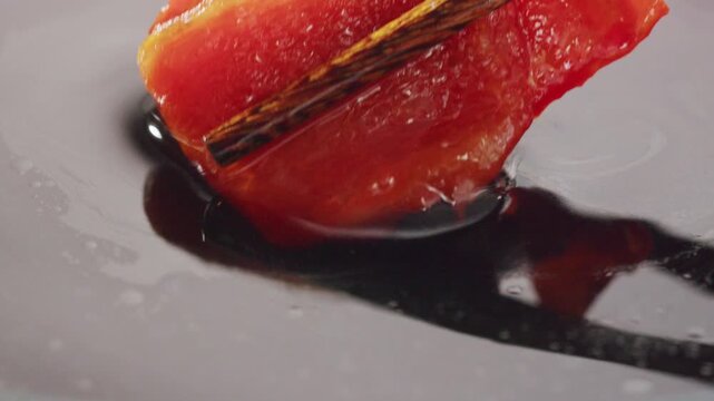 Dip with soy sauce Japanese brown teriyaki sauce in the spoon with circle rotation close up, sweet chilli in fast food restaurant