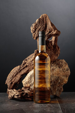 White wine with old snag and a piece of granite rock.