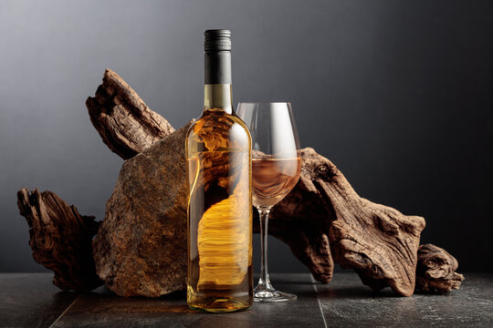 White wine with old snag and a piece of granite rock.