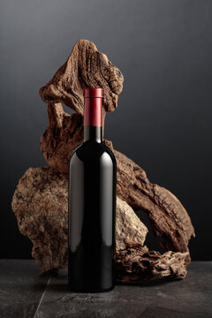 Red wine with old snag and a piece of granite rock.