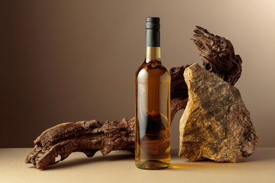 White wine with old driftwood and a piece of granite rock.