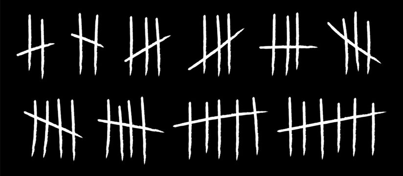 Set of hand-drawn white tally marks and scratched counting lines