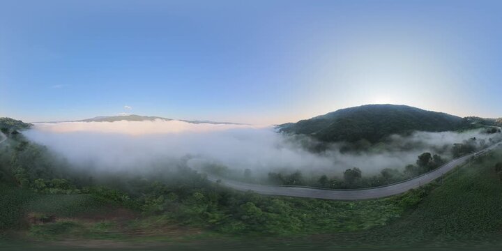 4K 360&deg; Panoramic View of a Winding Mountain Road Through Morning Mist at Phu Kao Ngom, Loei, Thailand