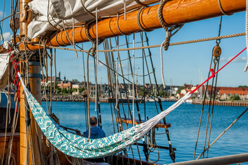 Hammock on sailing ship deck overlooking harbor © Georg