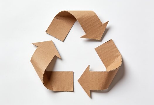Recycling symbol made from crumpled brown cardboard paper on clean background
