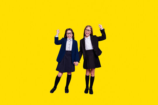 Full body photo of trendy stylish people raise fists scream yeah wear skirt long socks eyewear eyeglasses isolated over violet purple background
