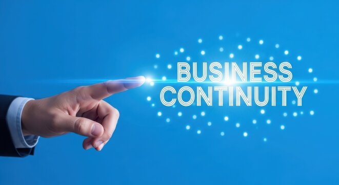 Hand pointing at business continuity text with light dots on blue background finger