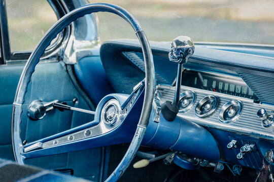 Vintage classic car interior with skull gear shift and steering wheel