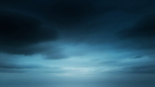Deep blue and teal sky with soft light breaking through clouds