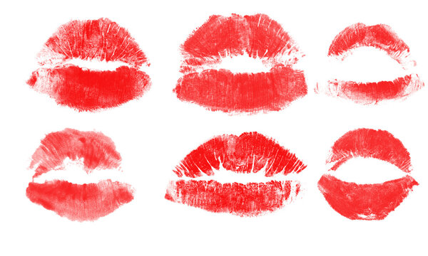 A collection of six distinct vibrant red lipstick kiss marks isolated on a clean white background, showing various shapes and lip textures isolated on a transparent background