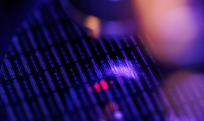 Plakat Closeup silicon microchip wafer with purple neon bokeh lighting for technology background and cyberpunk synthwave electronics
