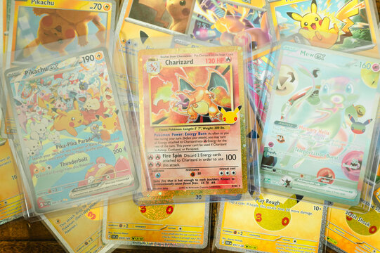 Chicago, IL/USA - September 19, 2026: A rare Charizard trading card is prominently displayed among colorful Pok&eacute;mon cards from the 30th Celebration set, including Pikachu and other collectible pulls
